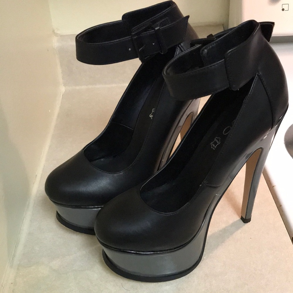 ALDO genuine black leather high heeled pumps.
